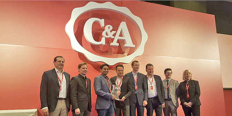 (Third and fourth from left) Shreyaskar Chaudhary, MD and Atul Mittal, VP – Garment, Pratibha Syntex with the award during C&A‘s Global Supplier Summit