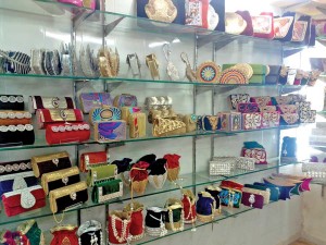 Hand embroidered and painted bags at Falah Handicraft showroom in Shahpurjat