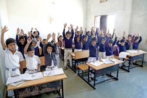 Happy children from nearby villages get an opportunity to study at the Vasudha Vidya Vihar Karhi