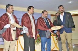 Dhruv Sharma receiving his certificate from Dilip Jiwrajka, MD, Alok Industries