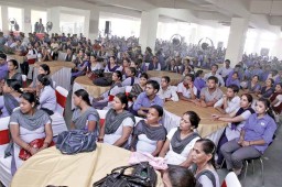 Workers listen attentively at the annual function to celebrate one full year at the new facility of IBG