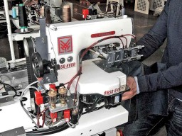 An earlier version of the 4650EV9R belt loop setter, now comes equipped with a 7 inch touch screen panel