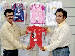 Balvinder Sharma, CEO, along with his younger brother Pawan Sharma, showing their product