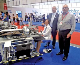 Bernd Bräuer, Heading Duerkopp Adler’s global sales division; and Dietrich Eickhoff, CEO, Duerkopp Adler with the new automat under the 745 series of piped pocket stitcher