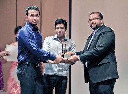 Kinshuk Shukla and Kshitij Sinha from the Bachelors in Fashion Technology batch of 2013 being presented with the awards by Sunil PP, Director, Adobe Systems India
