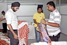 Jash Saluja, Director, Sahiba Limited on the shopfloor inspecting some of the digital prints in progress