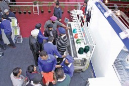 Visitors keening observing Shima Seiki SSR 112SV G flat knitting machine
