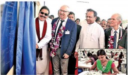 President Mahinda Rajapaksa unveiling the plaque of Omega Line Ltd.; also seen (inset) is a factory worker 