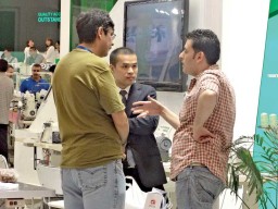 Douglas Zhu (centre), Overseas Marketing Director, ZOJE Sewing Machine Co. Ltd. engrossed in discussing with clients