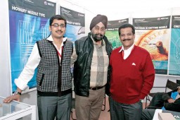 R. Anand, Sales Manager (L); P.C. Sethuram, Proprietor (R) with a client (in the centre) 