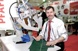 Peter Wingerter, Sewing Engineer, PFAFF, showcasing the tape sealing machine