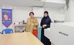 Studio Technical team Syeda Mahtab and Faiza Zaman, standing besides Veit Kannegiesser fusing machine