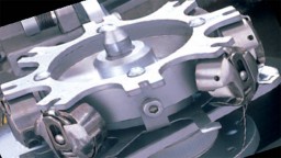 Automatic Bobbin Exchanger for ROBO Quilter. Courtesy: ABM ROBO Quilter Brochure, ABM International Inc.
