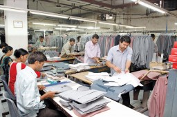 Cardboard folders are used in the finishing department for folding the shirts in a swift and uniform manner