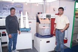 Ram Krishan, Owner (L) with Rajesh Krishan, CEO of Paradise Engineering Corporation presenting the knit checker and stretch wrapping machine
