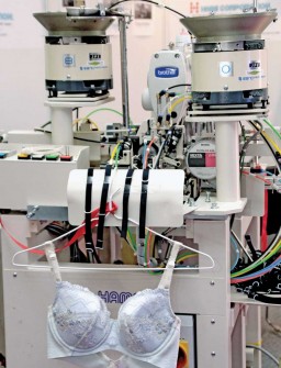 The MHA-600BB Bra strap sewing machine from Human Apparel Solutions (HAMS) Japan, combining the whole process of bra strap preparation in a single operation