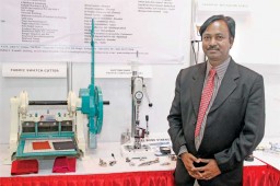 Jagadeesh H, Owner of Amith Garment Services, stands proud with the Button Snap Pull Tester from the company