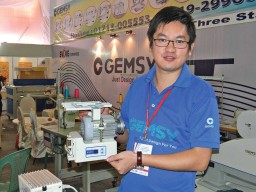 Justin Chueng, Assistant Manager- International Trade Department, Gemsy with the Brushless Energy-Saving Servo Motor, at the recently concluded Garmentech fair of Bangladesh