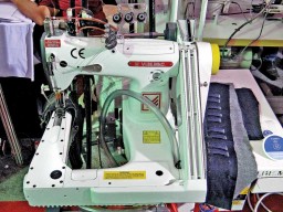 The 2261HP is a reverse-arm lap felling unit, three needle chainstitch for double lap seaming on jeans, casual trousers, and workwear