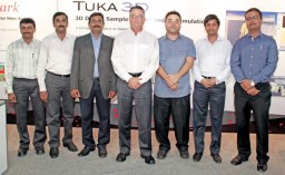 Brad Whiteley, Director, Tukatech (centre) with his team
