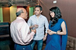 Sharif Zahir, MD, Ananta Group (centre) and his wife in deep discussion with Anil Tandon, MD, Tez Zippers