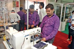 Anshuman Dash of Loiva showing the popular ST-10 button wrapping machine and ST-12 button feeder machine