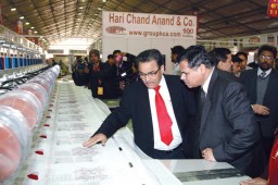 Anil Anand, MD, HCA explaining the embroidery machine to Uday Kumar Verma, Secretary, MSME