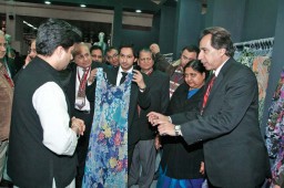 Jyotiraditya Scindia listens carefully as Lalit Thukral, MD, Maharana of India explains the specialty of the dress that attracts his attention during his round of the fair