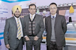 (L to R) Lovedip Singh Tongia and Mukesh Dharmani from Textile Machinery Division, Voltas Limited with Jim Gu, Sales Representative, LongXing