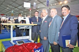 (L-R) Virender Uppal, Chairman, AEPC; HKL Magu, MD, Jyoti Apparels; and Akshay Sharma, CEO, Magnum Resources unveiling the new Brother S-7300A sewing machine