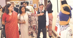 Maneka Gandhi being shown around the displays of fashion based on the sustainability theme by faculty of IAM 