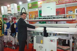 Metin Kilic, Factory Manager, Malkan showcases trouser pressing equipment at the Welco stall