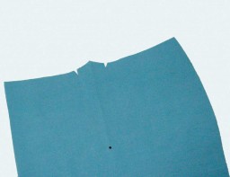 Notches and a drill mark on a component