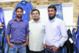 Abid Saboor, Marketing Manager, Artistic Fabric Mills (C) with his team