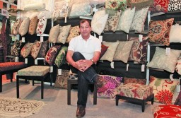 Asif Kamal of Woodson Impex, Delhi with Crewel embroidered cushions