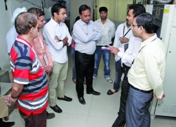 Participants at the Apparel Resources workshop on fabric, discuss technicalities with experts