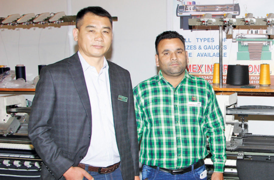 Harish Daffu (R) of Omex International with Wang Jian Cheng of Shangyu Longchima Textile Machinery 