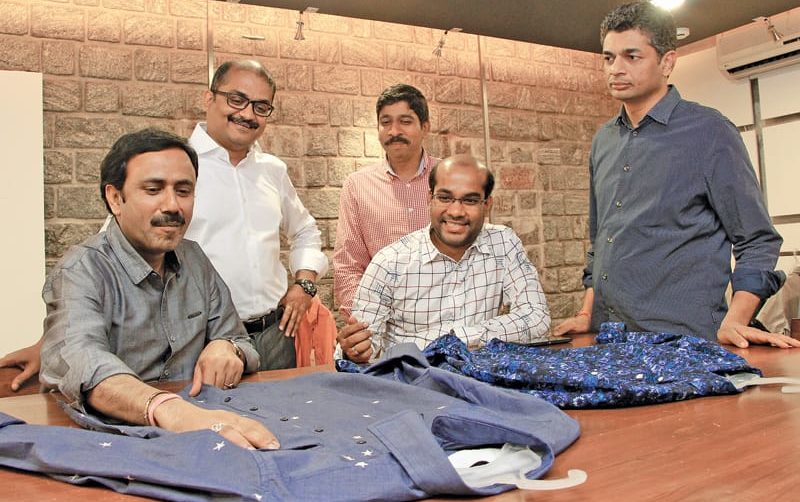 Nagesh Badida, Executive Director (extreme right) and Parameswar Chopparapu, Global Manufacturing Director, Aquarelle Group (standing next to him) with their senior team at the Aquarelle factory that manufactures casual shirts