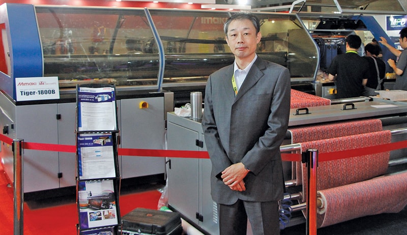 Tomohiro Ikeda, MD, MIPL with the newly launched Tiger-1800B, a digital textile printer for Indian market