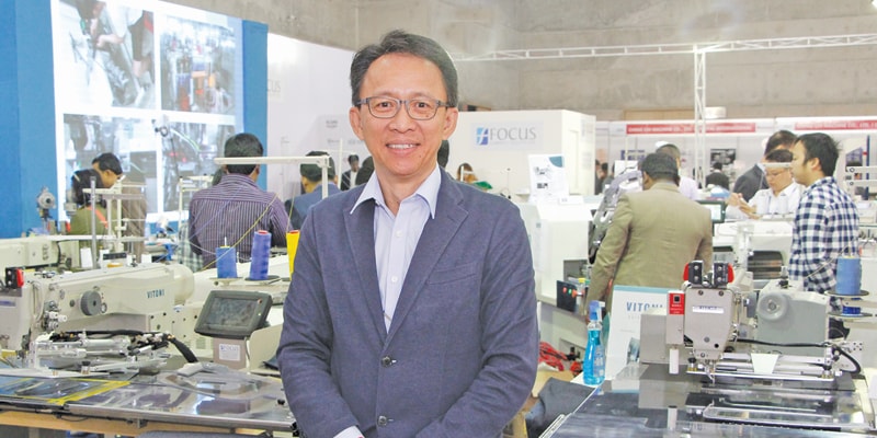 FooToon Pow, Managing Director of Focus Garment Tech at his booth