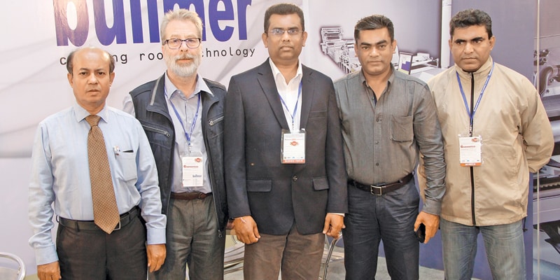 Reinhard Kohler (second from left), Area Manager – Bullmer; and M A Saleque (second from right), Managing Director – Uni Asia Associate, with their team members and an important client from Univogue Group, at the fair