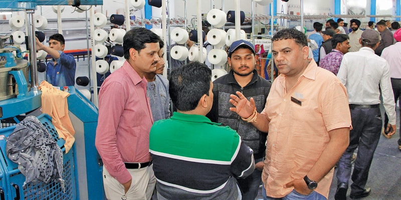 Parmesh Wassist, Director, Ramana International (extreme right) in discussion with visitors